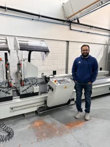 CAD engineer operating advanced machinery at Direct Trade Windows.